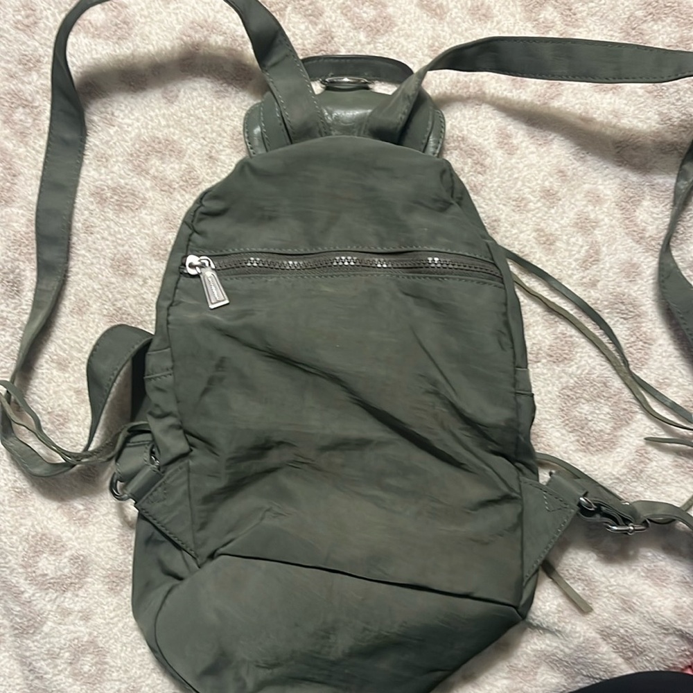 Rebecca Minkoff small canvas material. Bought used. Never used.